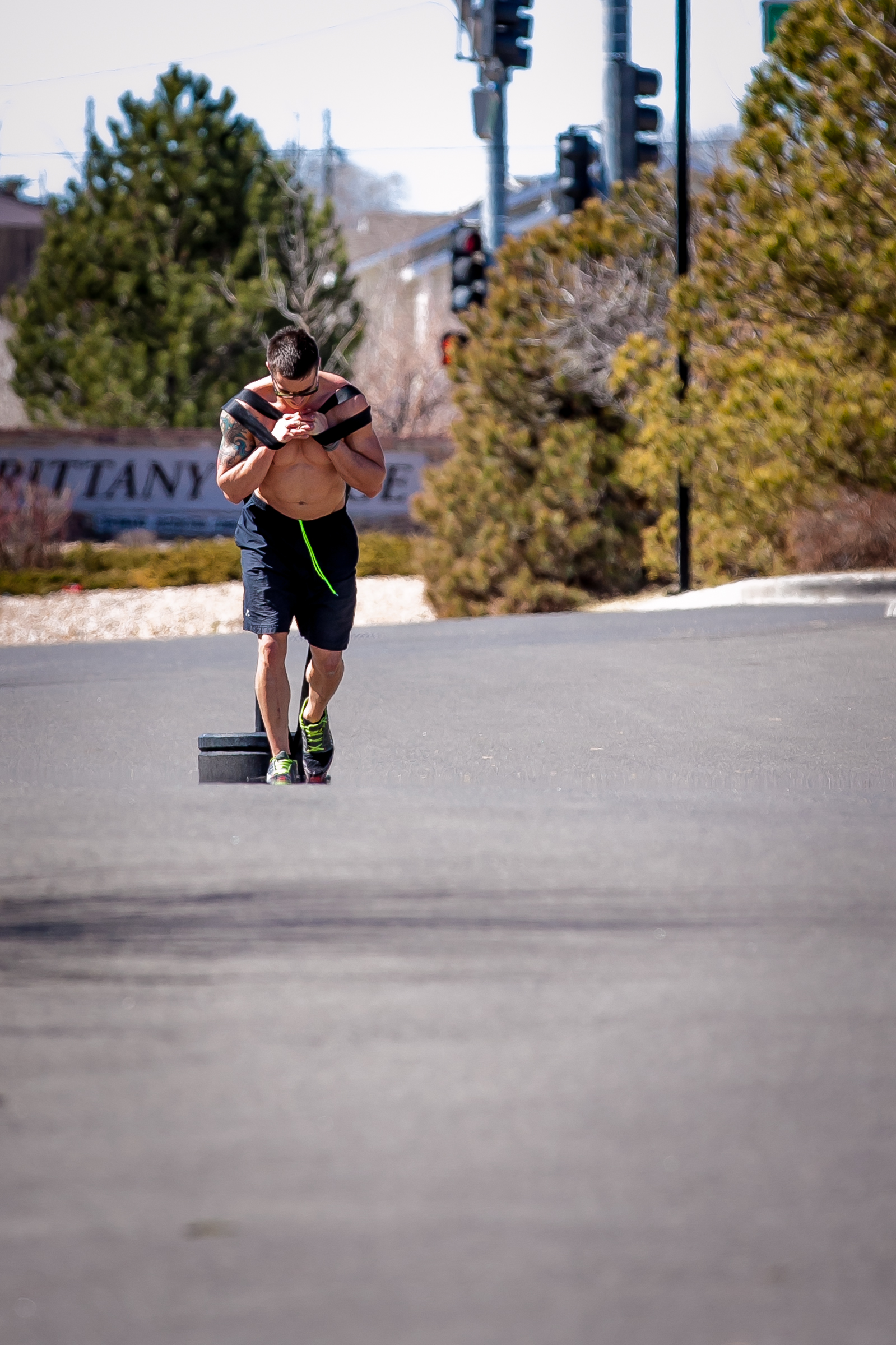 Athlete Pulling Heavy Sled outdoors at CrossFit Eminence