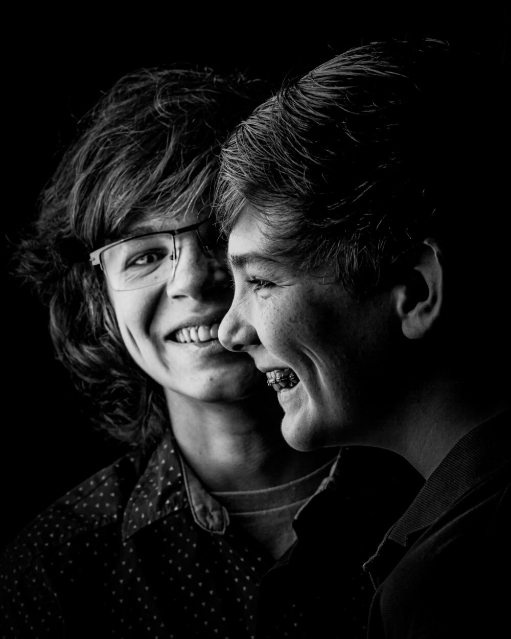 Black and white close-up of two laughing boys