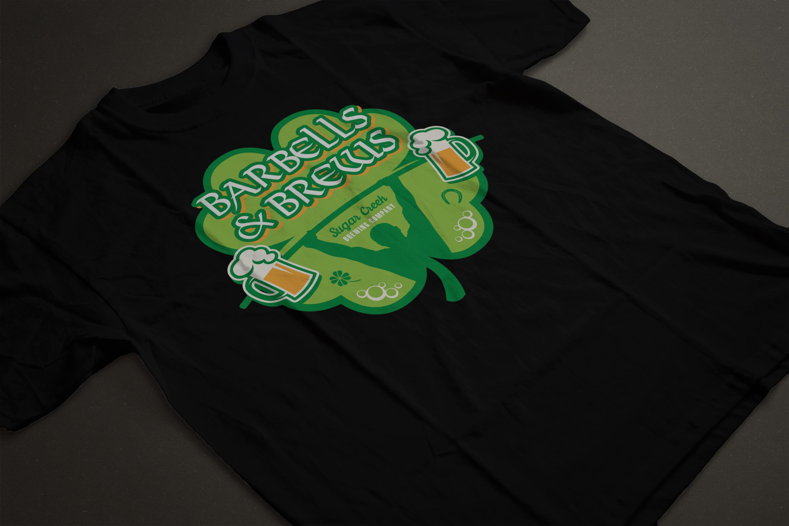 Black t-shirt with ‘Barbells & Brews’ green logo, beer mugs and barbell design