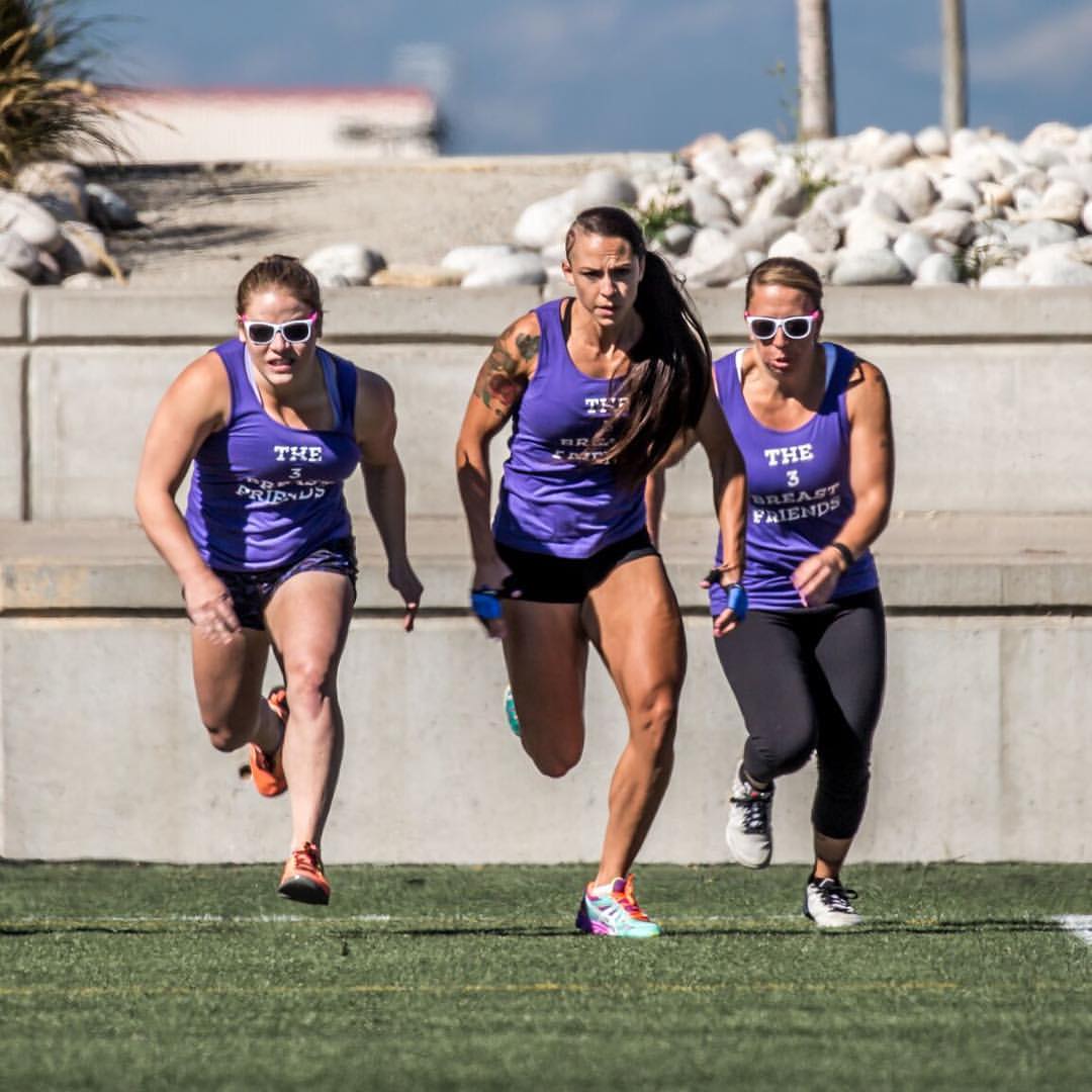 Dynamic Trio: Best Friends in Purple Tanks Sprinting Together, Exuding Team Spirit and Friendship