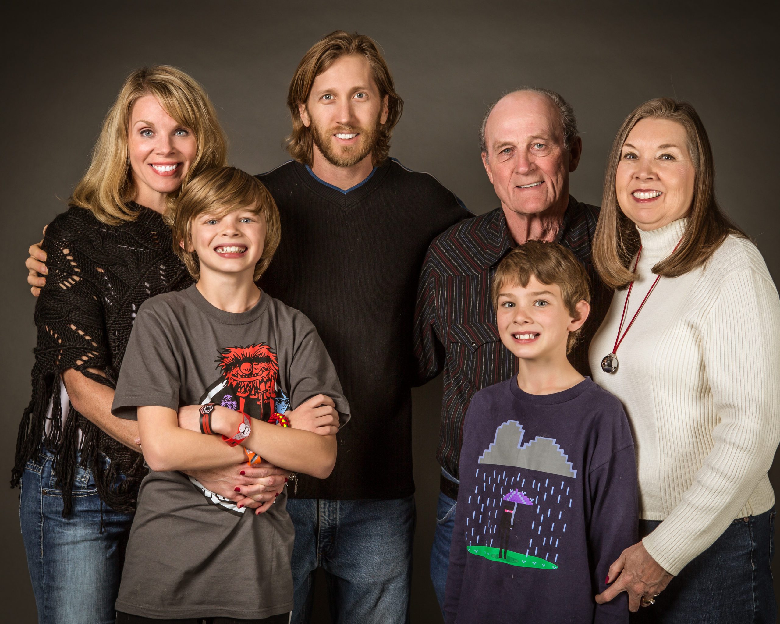 Multi-generational family posing together for a portrait