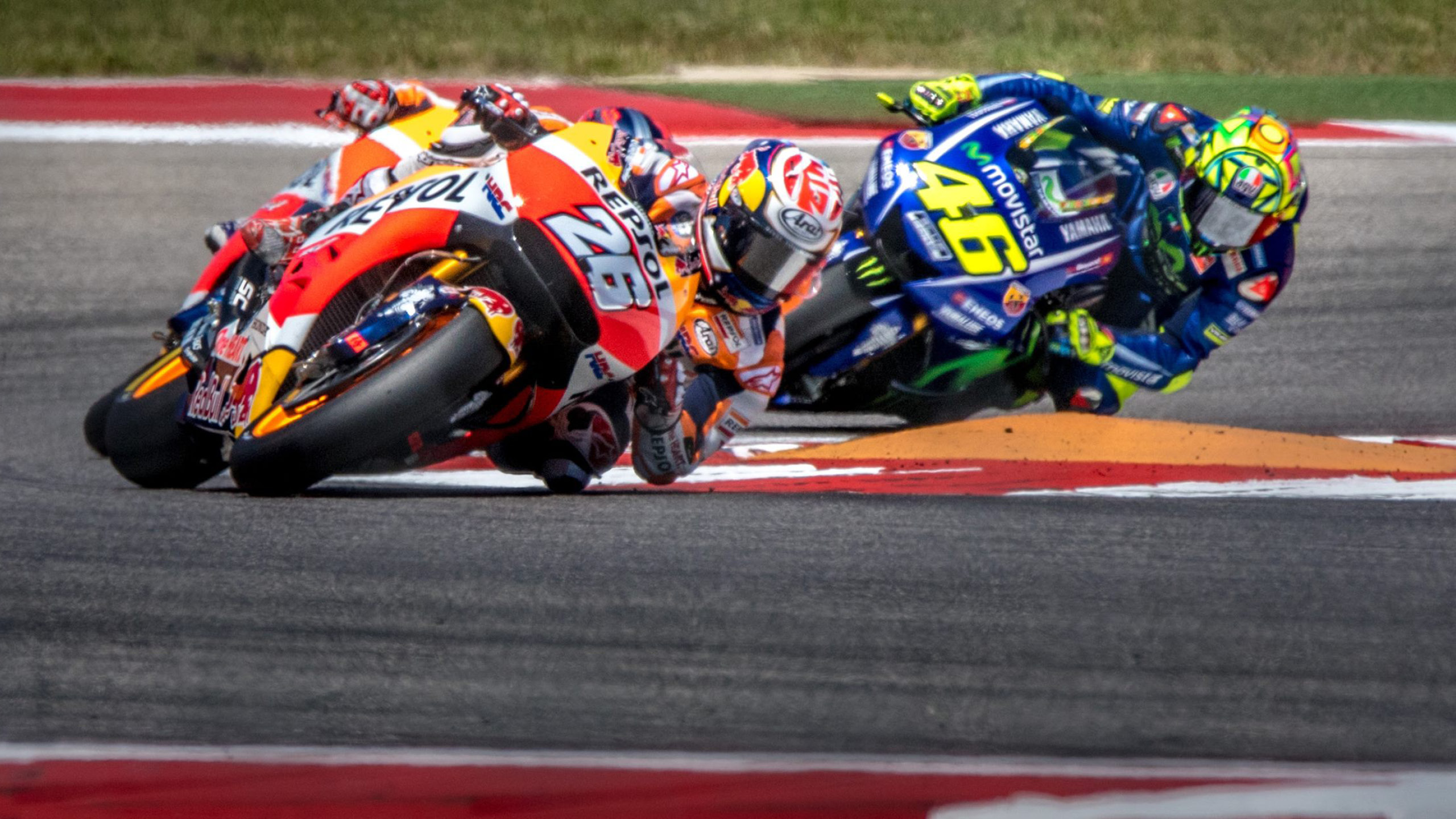 Marc Márquez and Valentino Rossi race at the Circuit of the Americas track in Austin Texas